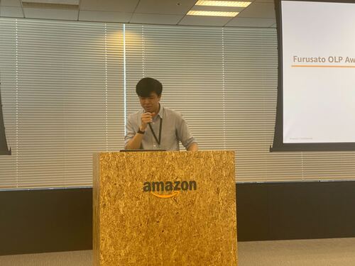 Team photo showing Furusato team members at Amazon Japan